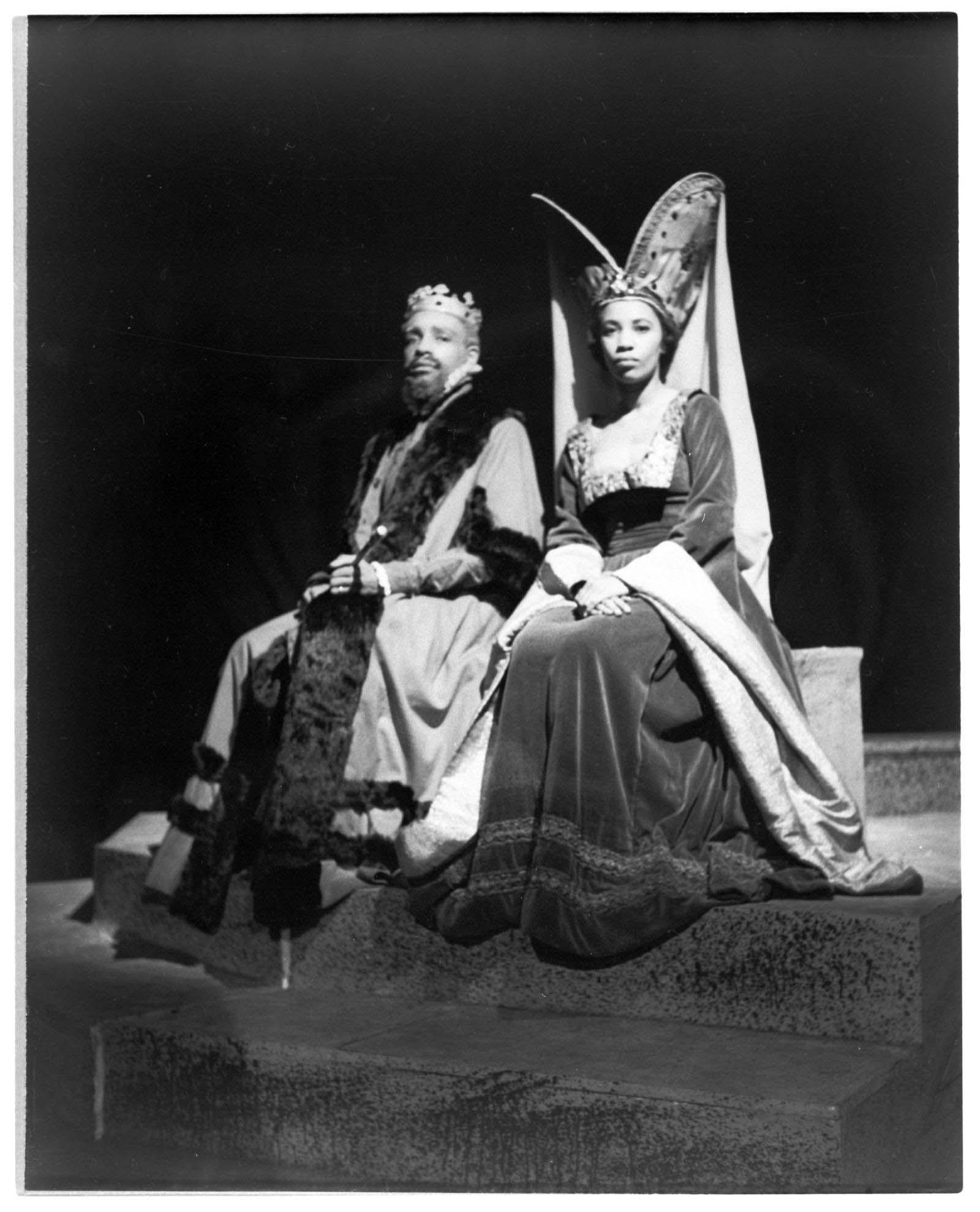 Vintage Howard University theater photo. Two people dressed in royal attire. The photo is in black and white