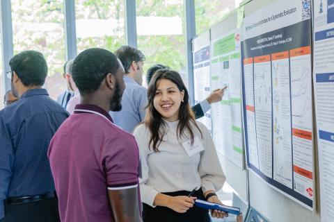 students show research poster at research month