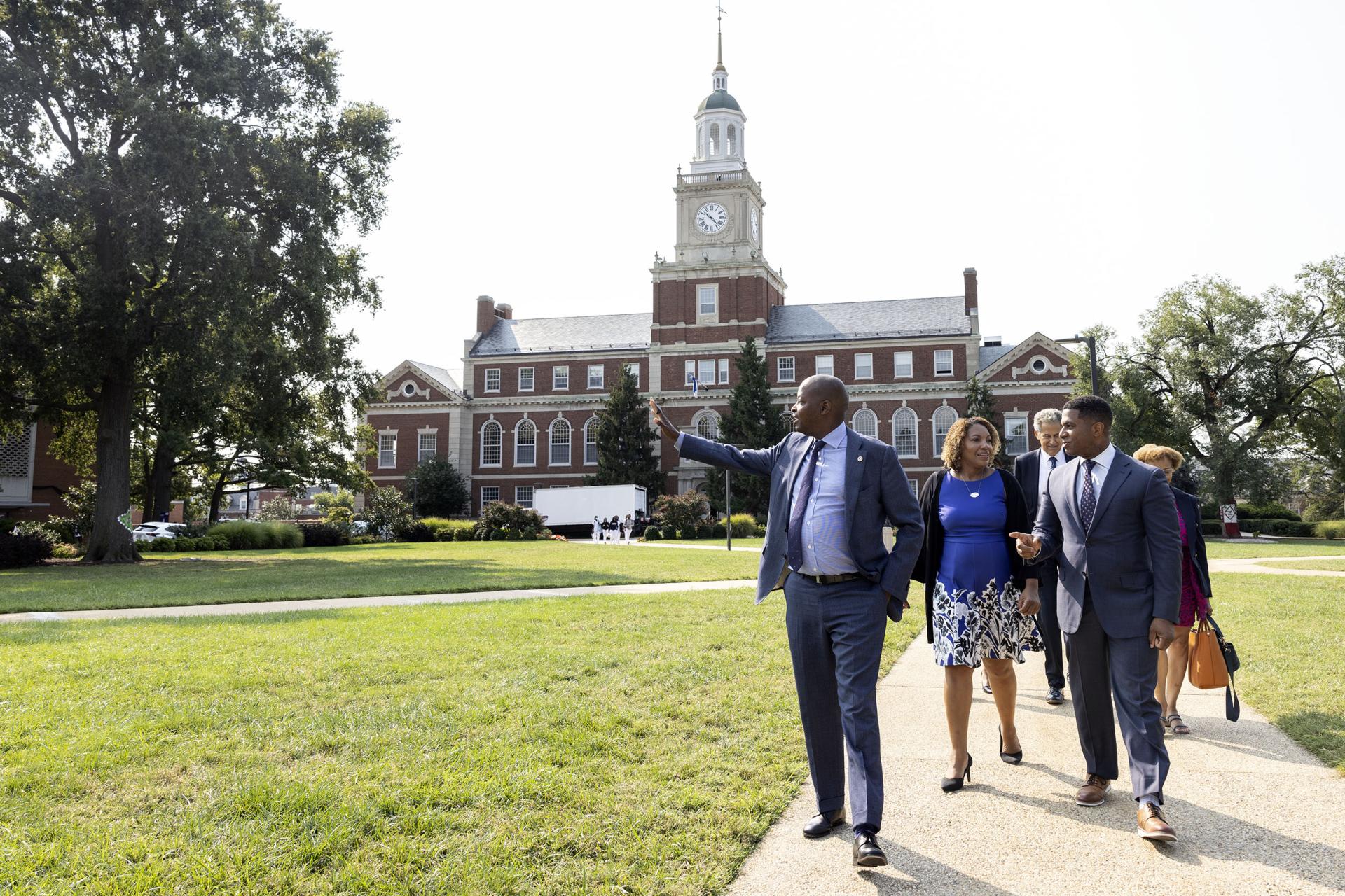 Dr. Frederick with new trustees in front of Founders Library