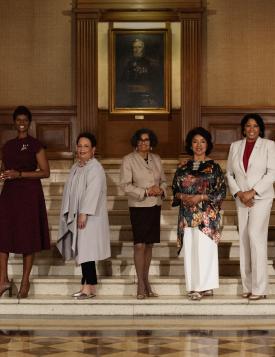 nine women deans of Howard University on stairs