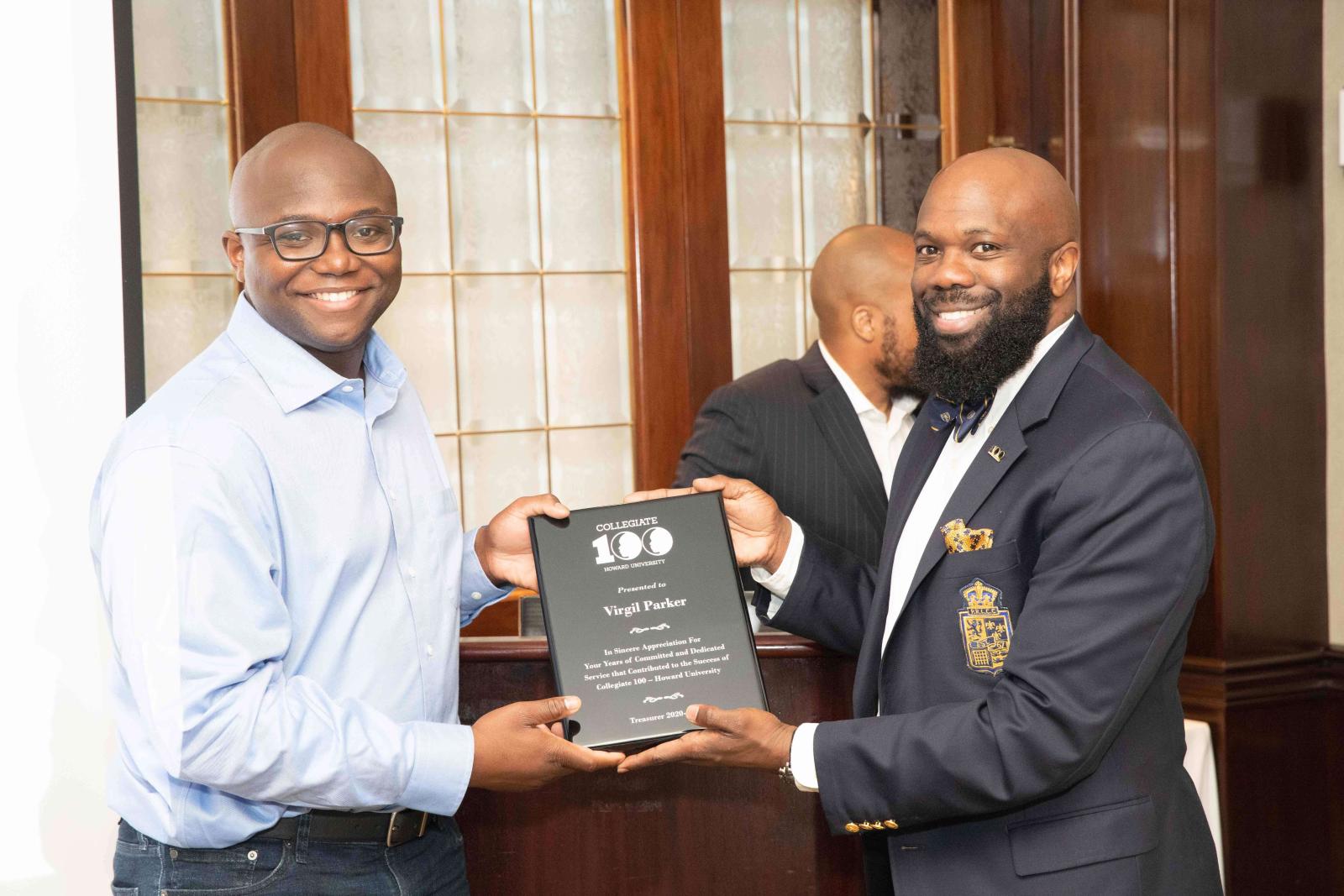 Virgil Parker receiving a plaque