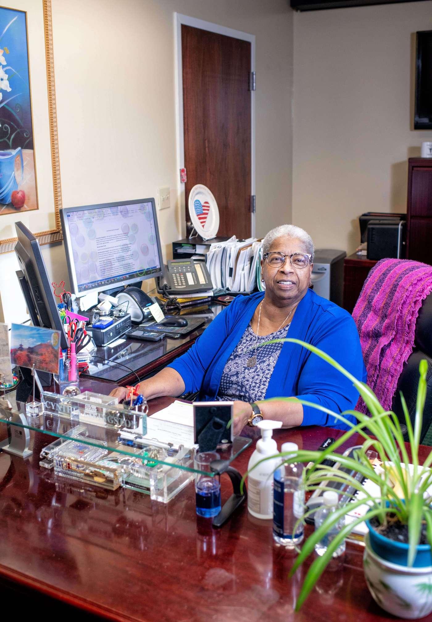 Cynthia Livingston at her desk