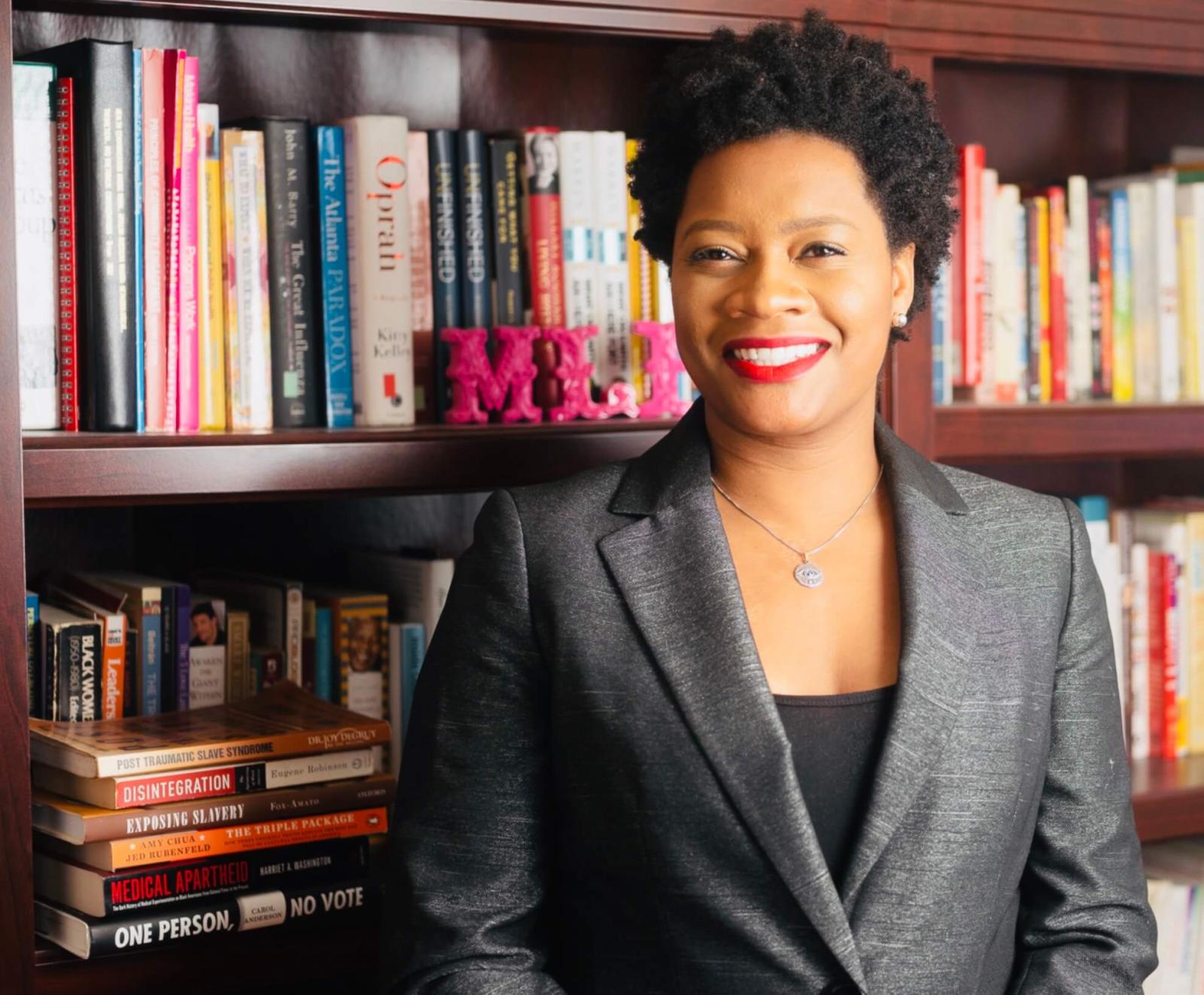 headshot of Monica Ponder in front of bookcase