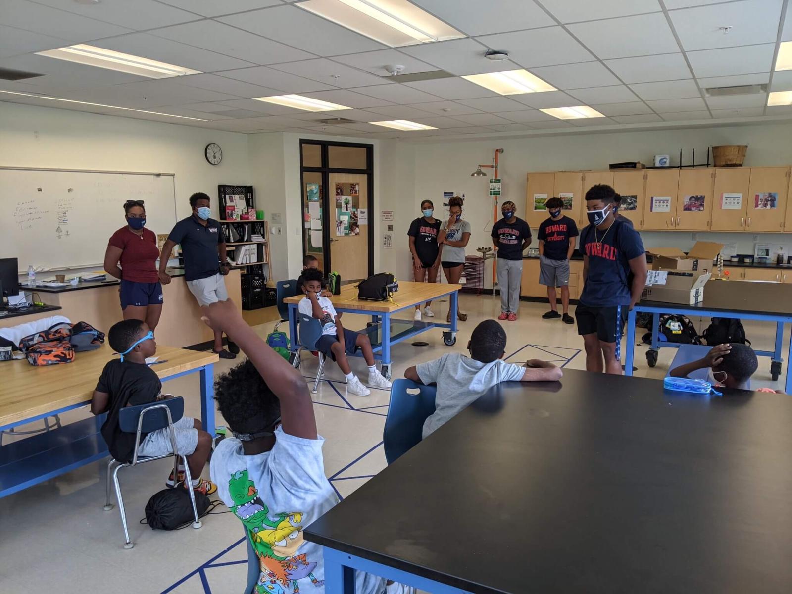Howard Swim team in a classroom with students
