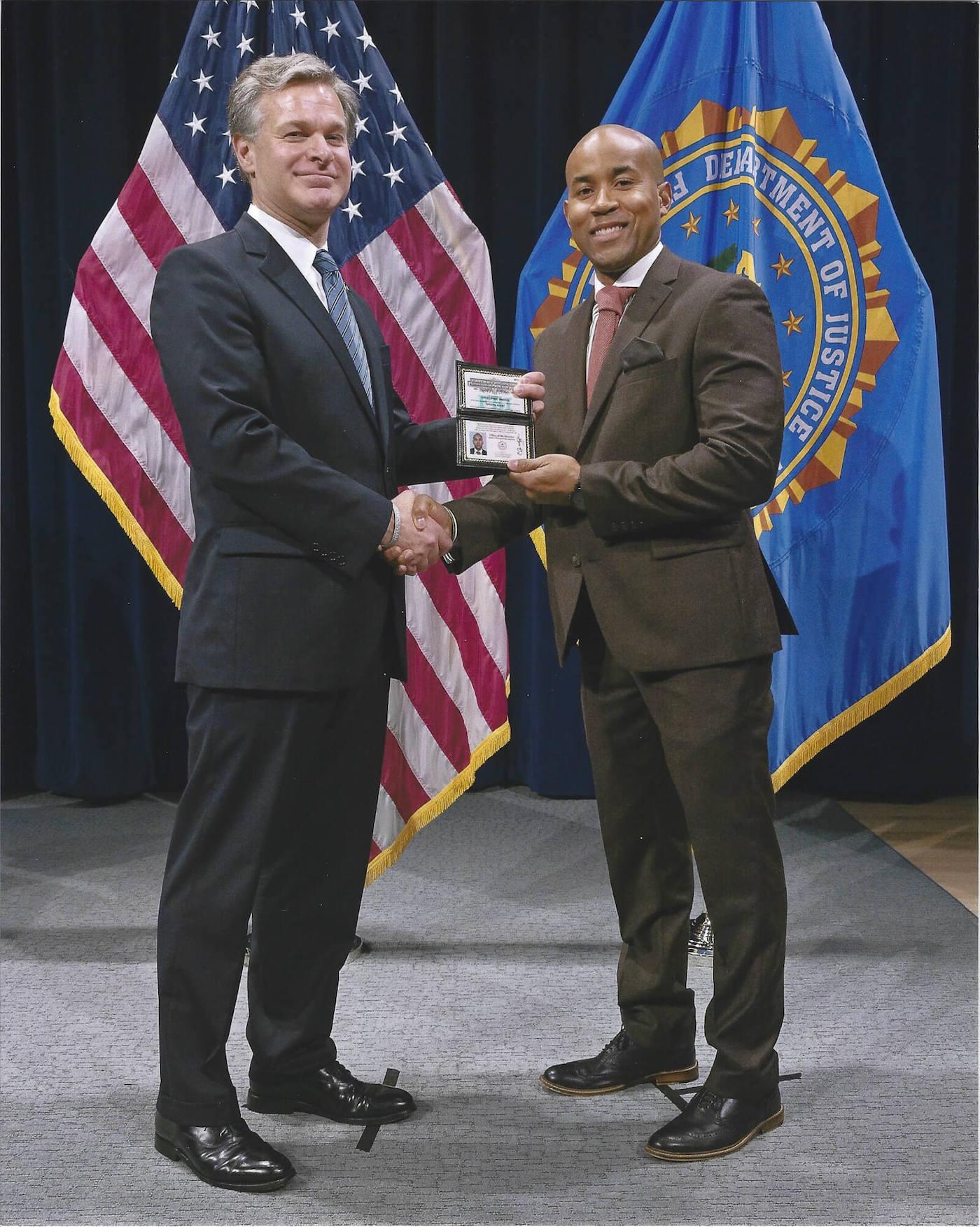 Chris Bridges receiving an award on a stage