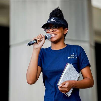 Howard student with microphone at a protest