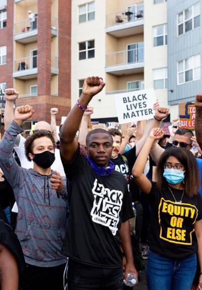 Students at protest with fists raised 