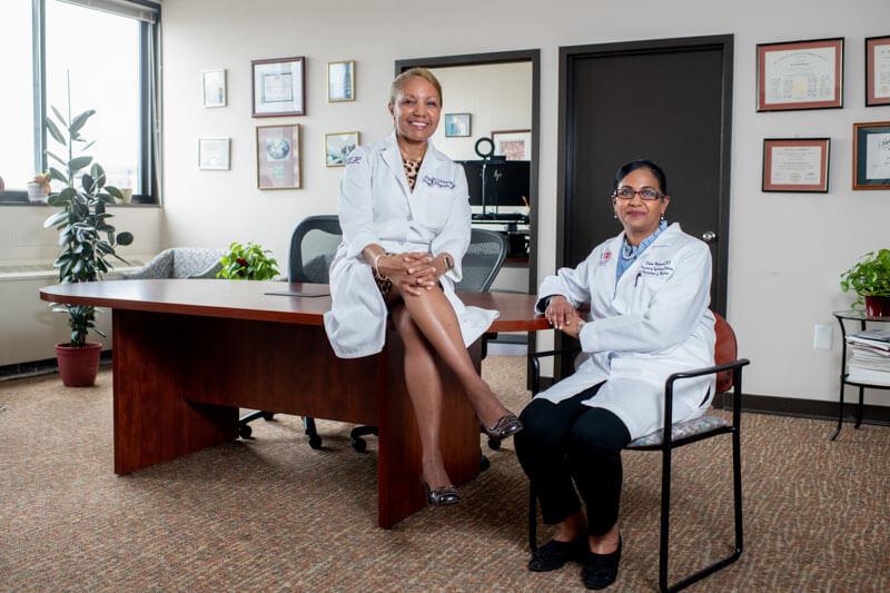 Two doctors sitting at a desk