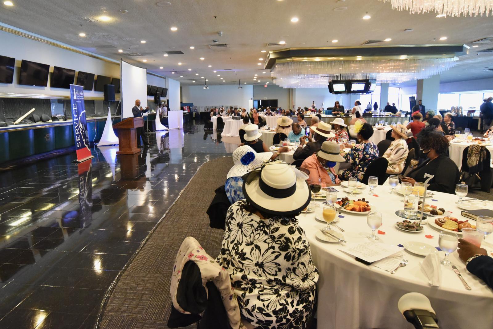 people with hats sitting at tables