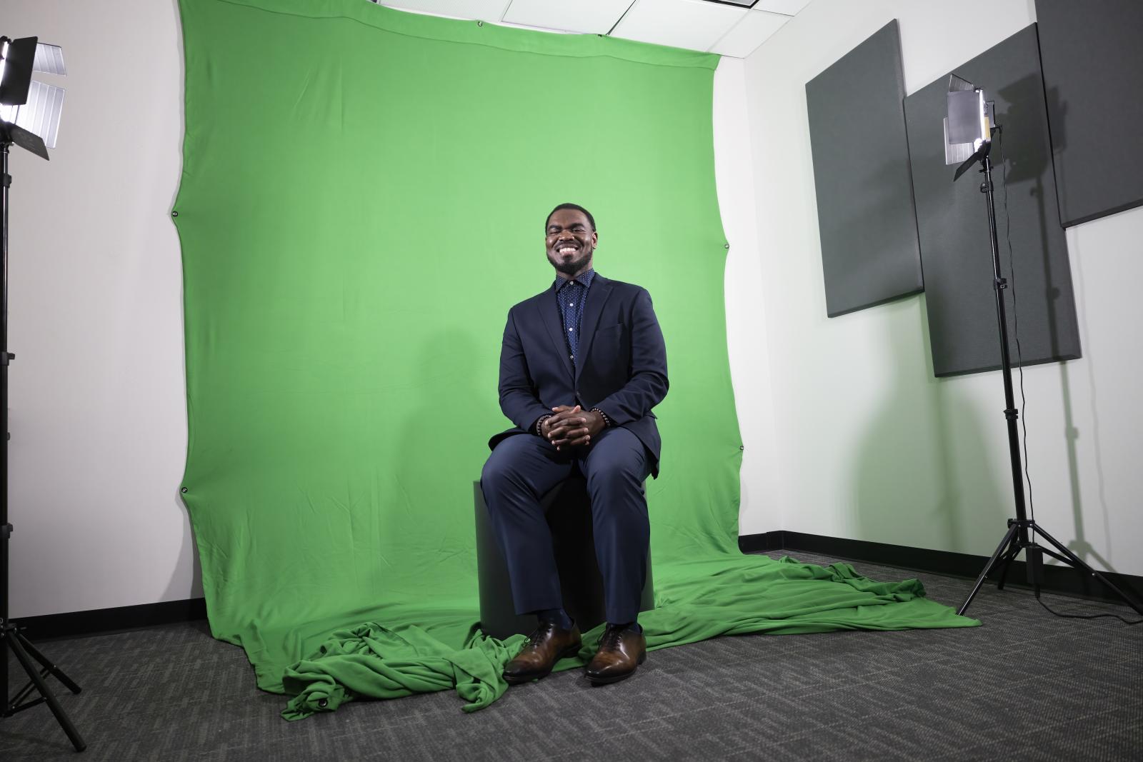 Morris Thomas in front of green screen