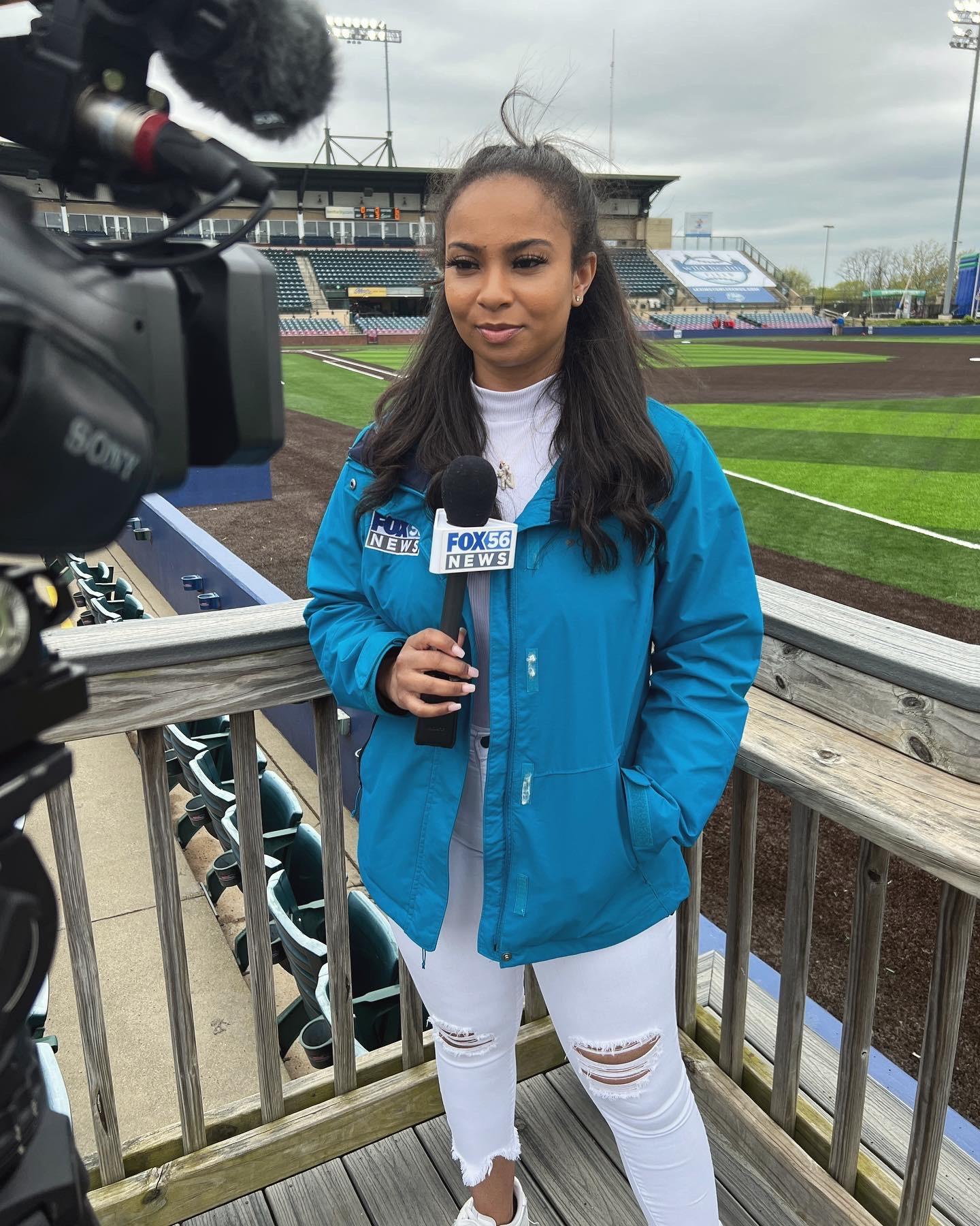 CBS Sports sideline reporter AJ Ross interviews Miami Dolphins