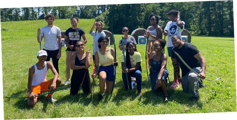 group posing with archery