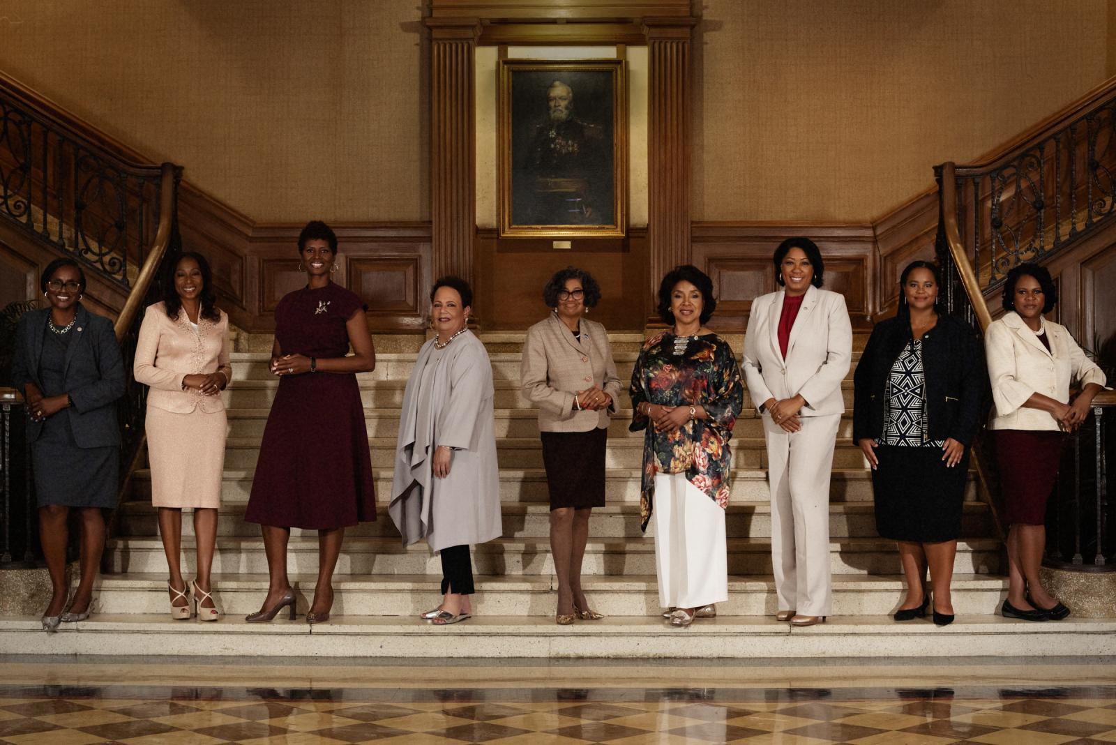 nine women deans of Howard University on stairs