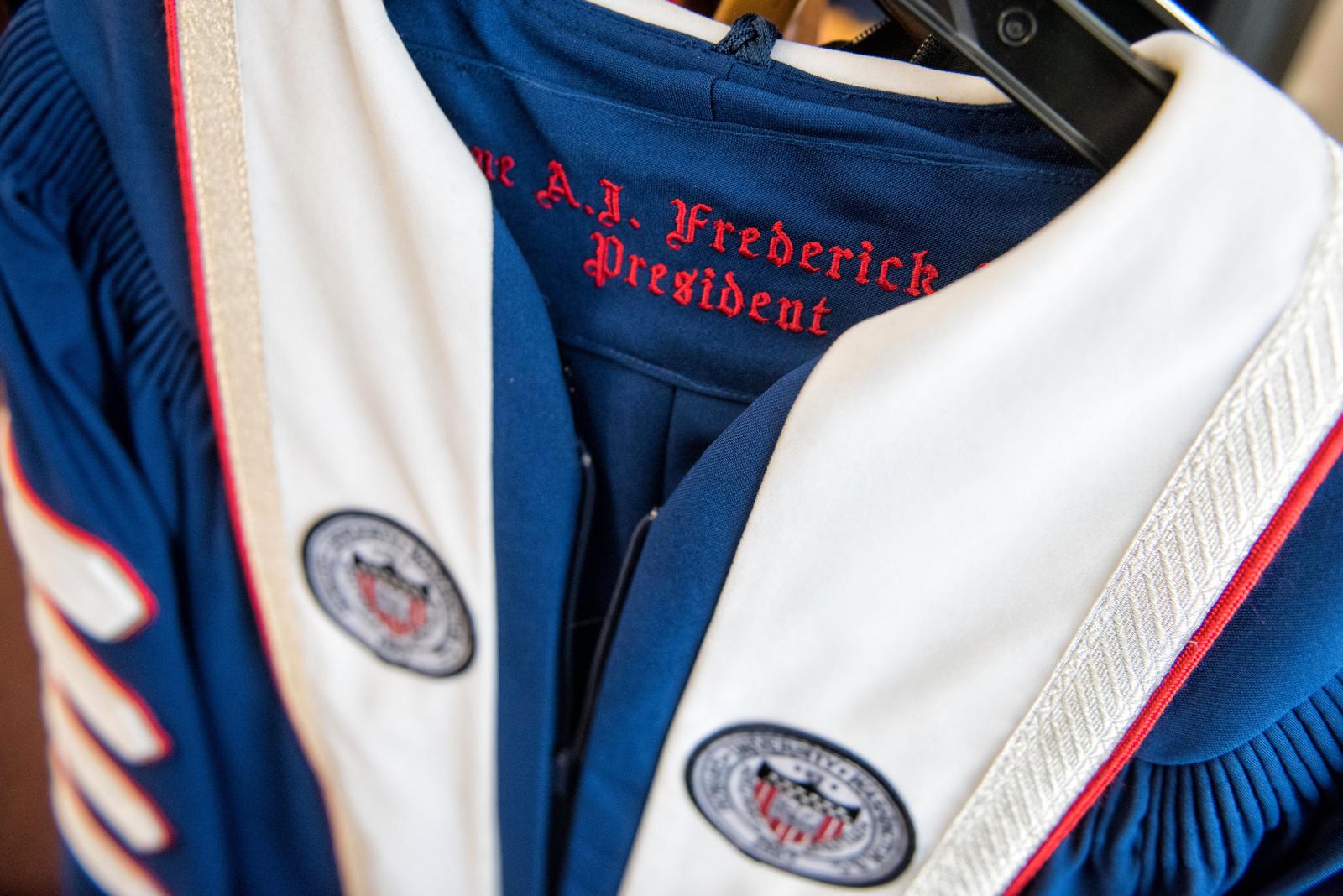 Dr. Frederick name inside robes