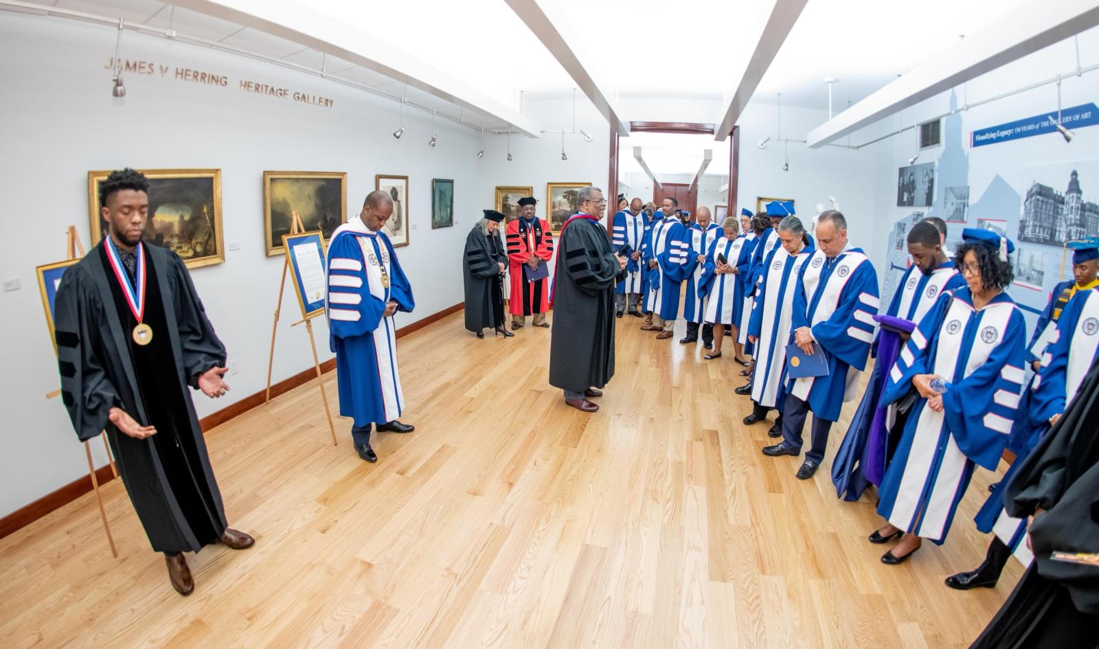 Chadwick Boseman with trustees before graduation