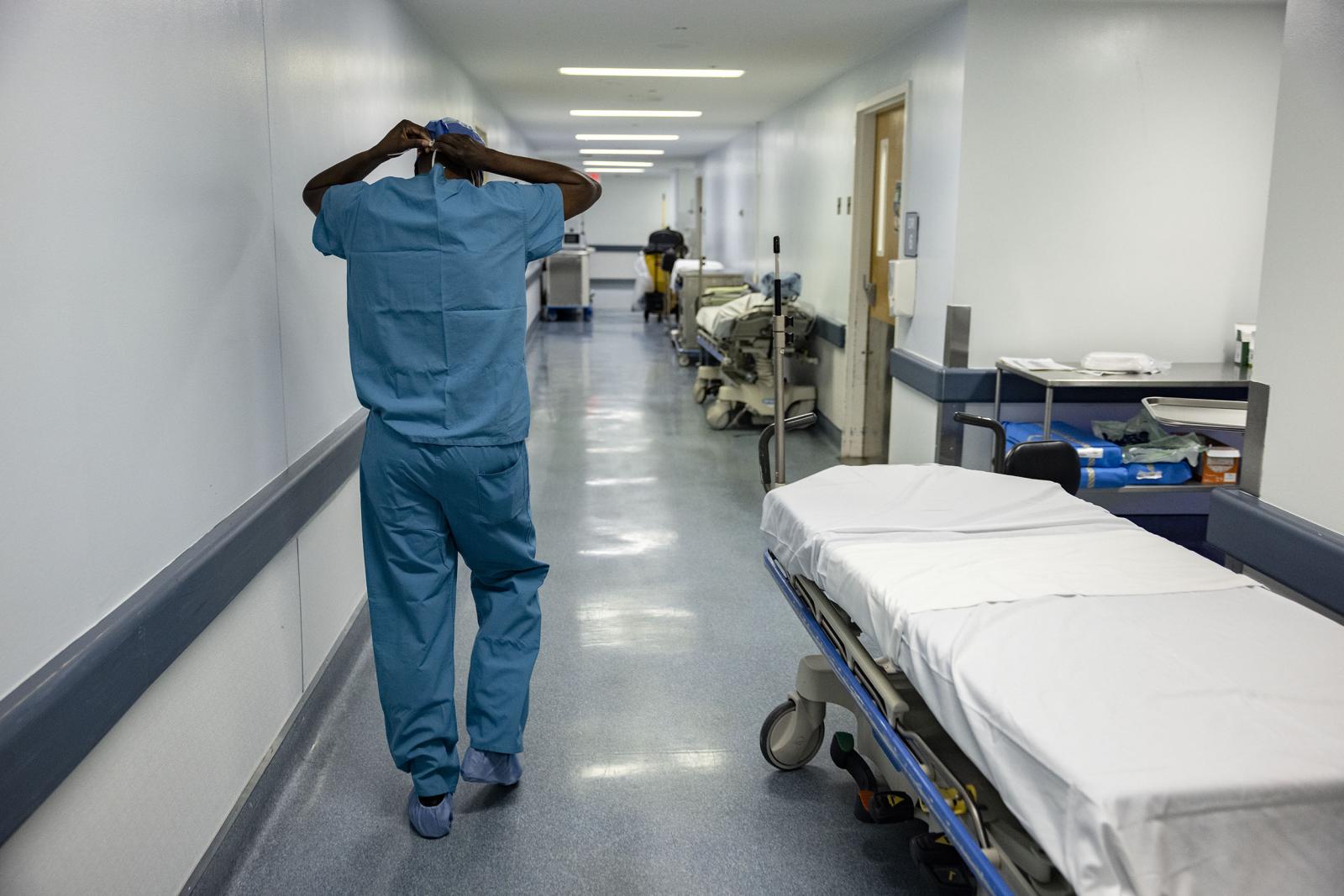 Dr. Frederick walking down surgery hall