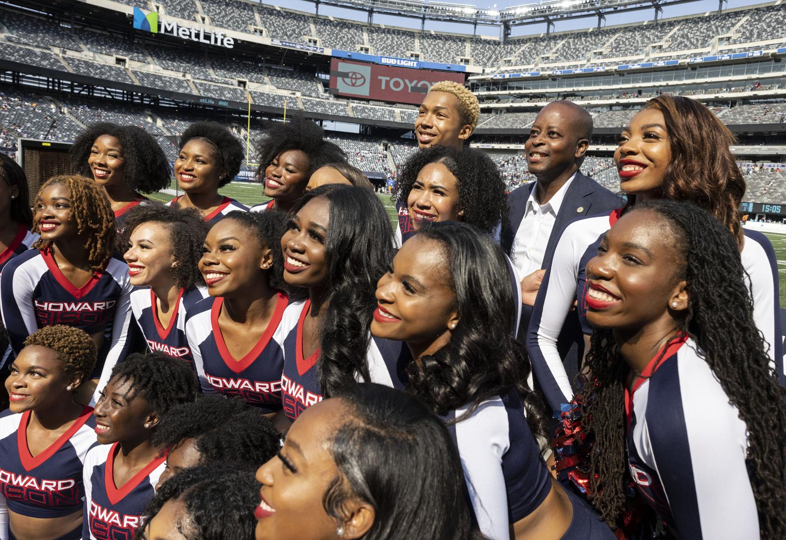 Dr. Frederick with cheerleaders