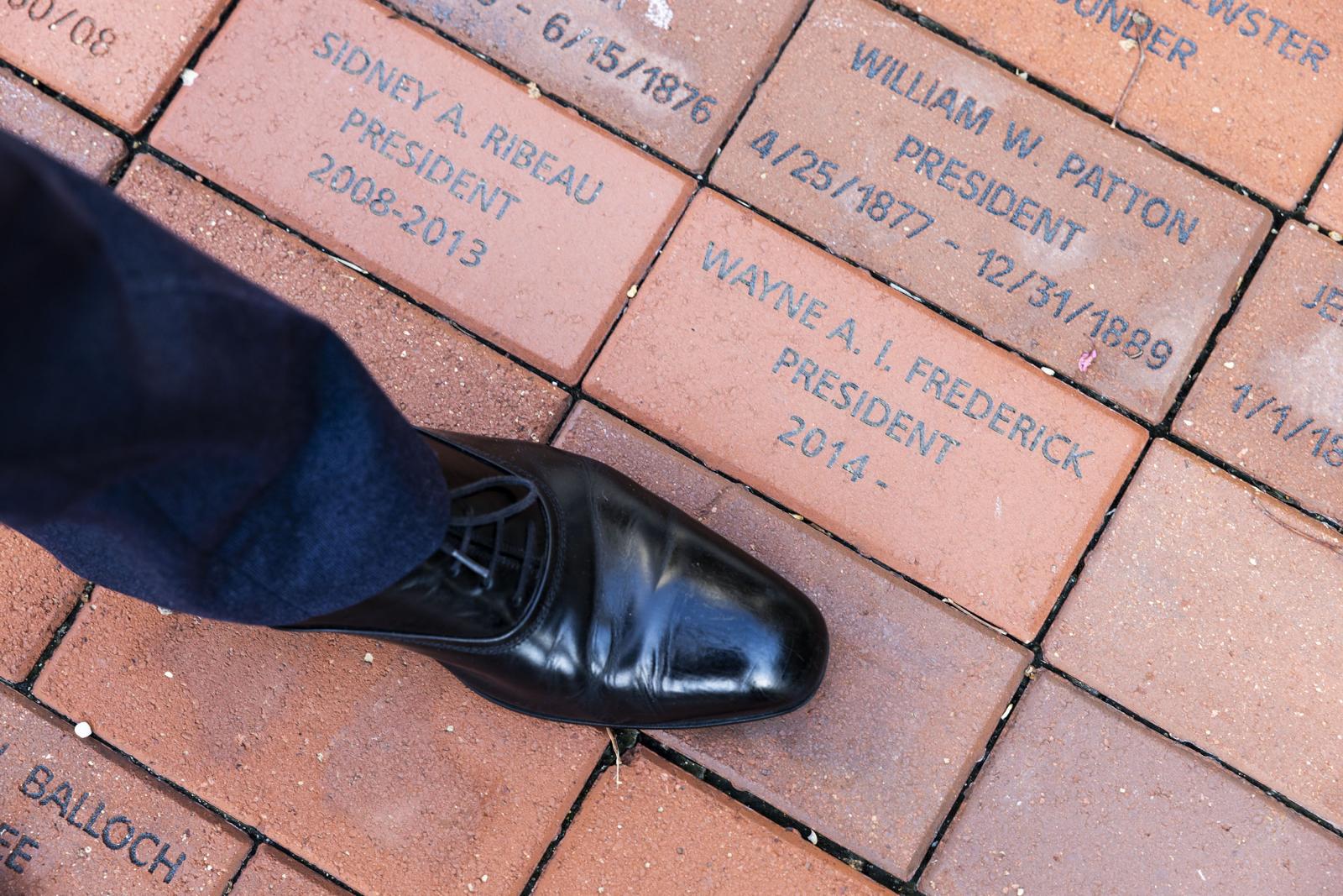 Dr. Frederick's shoe by his brick with name