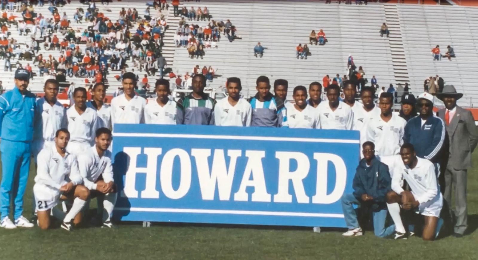 Dr. Frederick managed the Howard soccer team (in the dark blue jacket kneeling by the letter D)