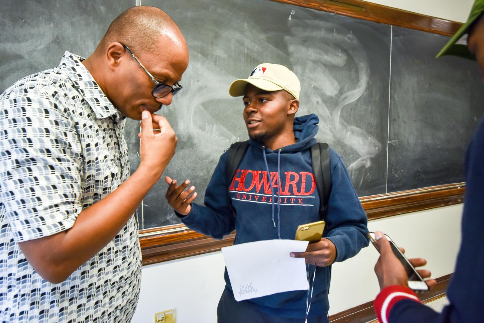 Howard student talking with professor