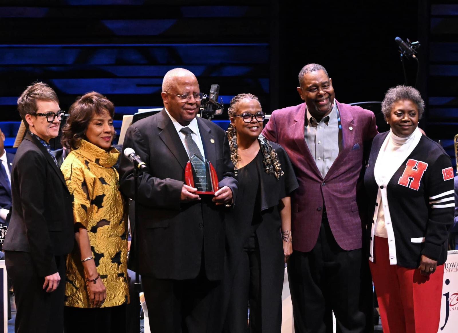 Fred Irby with group from Howard receives plaque