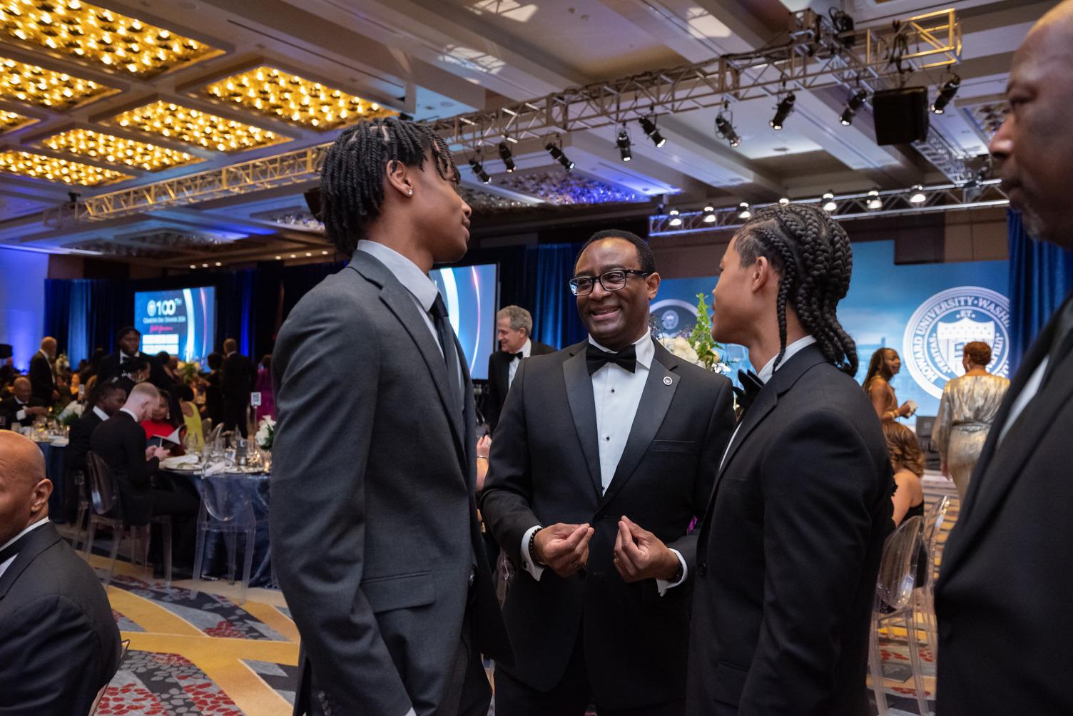 Howard University President Ben Vinson III chats with student attendees during the 100th Charter Day Dinner. (Source: Howard University)