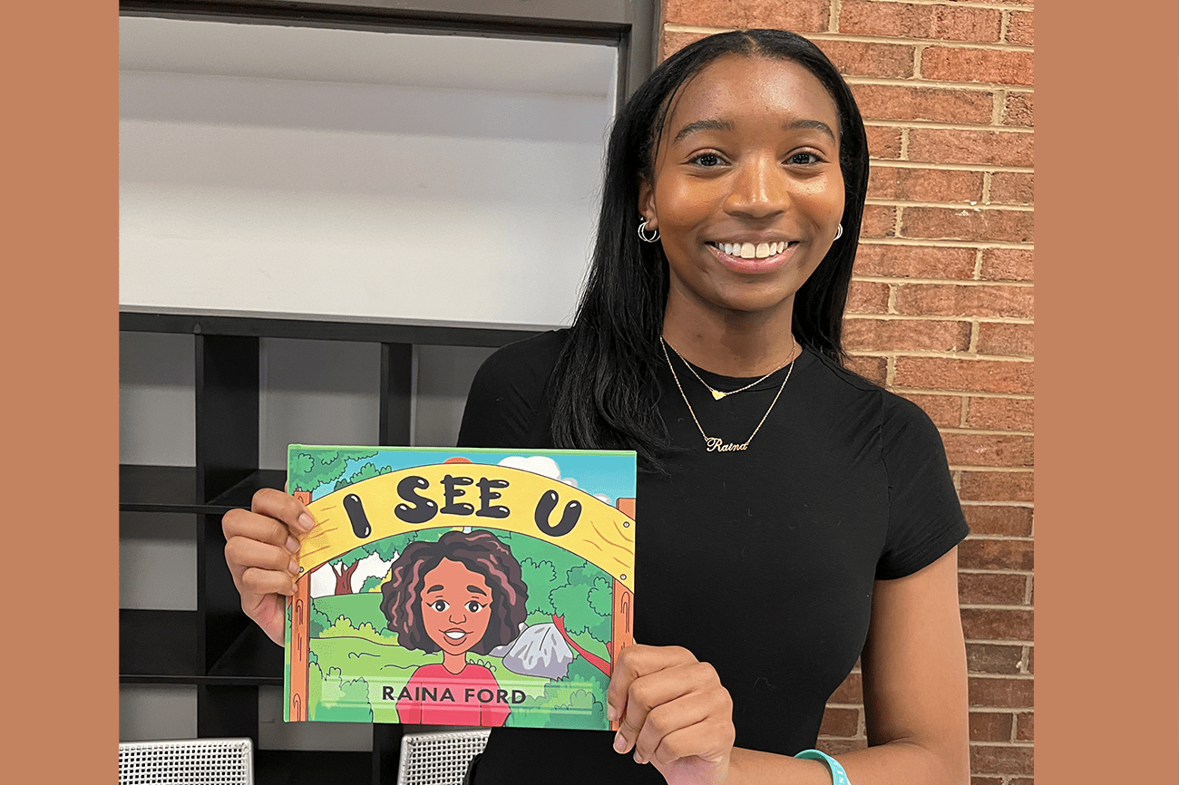 Image of student with her book, I See You