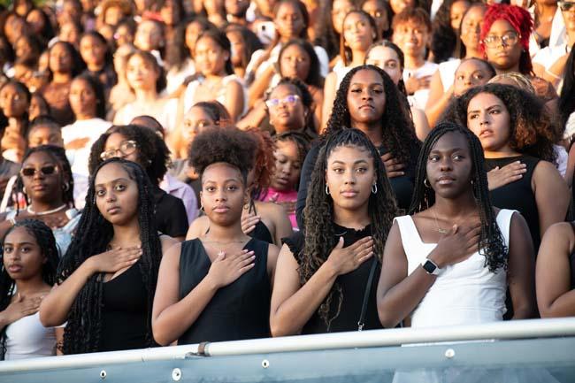 Students take the pledge during New Student Orientation.